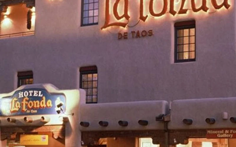 Pueblo-style facade of Hotel La Fonda de Taos on the Plaza, a base for the Taos hot springs in New Mexico