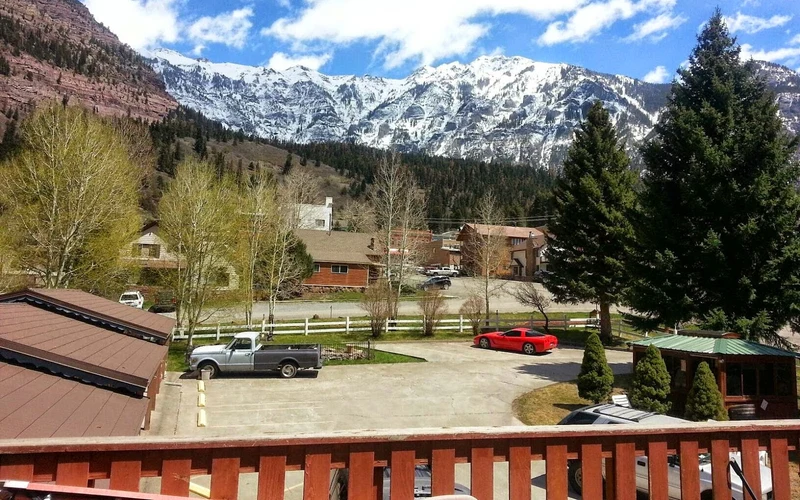 Ouray Inn guest rooms and patio a short walk from the Ouray hot springs pool, Colorado